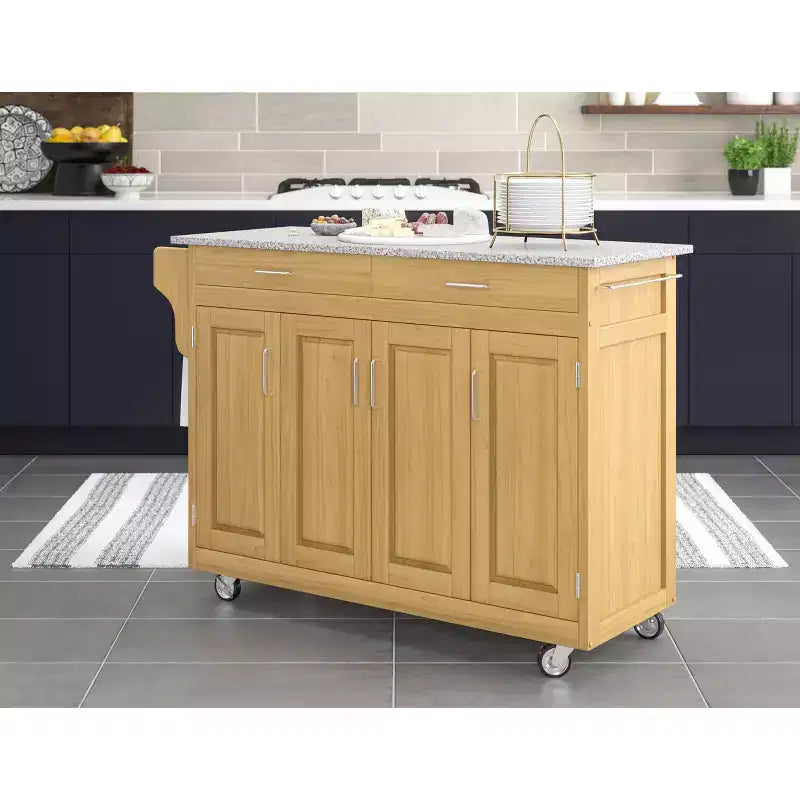 Carrello da cucina in legno naturale tinto con top in granito nero